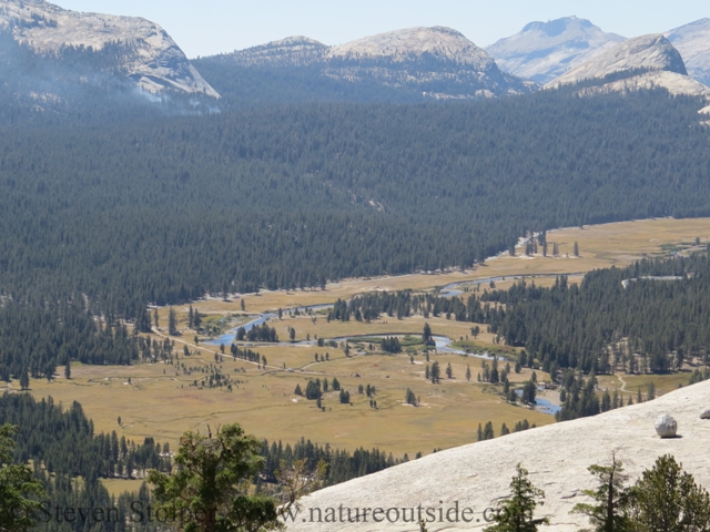 Tuolumne Meadows Below. There is smoke from a potential forest fire.