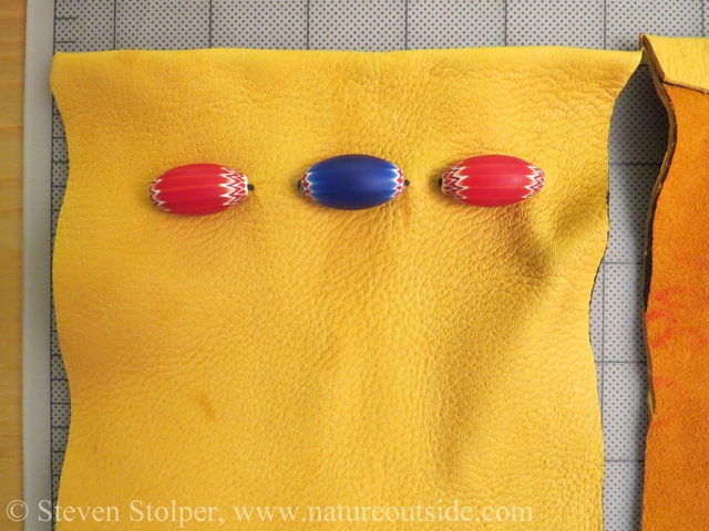 The beads attached to the pouch.