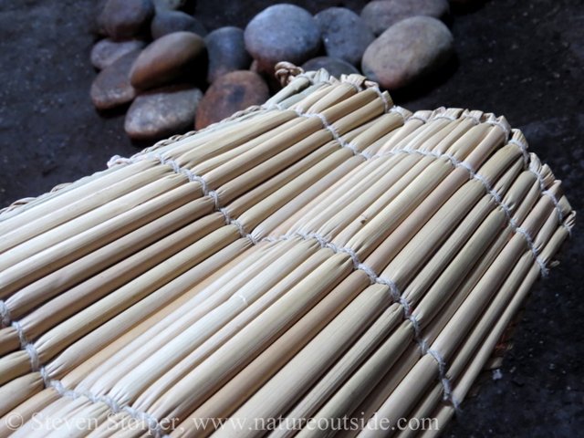 Tule sleeping mat. Cotton thread is twined around tule reeds.