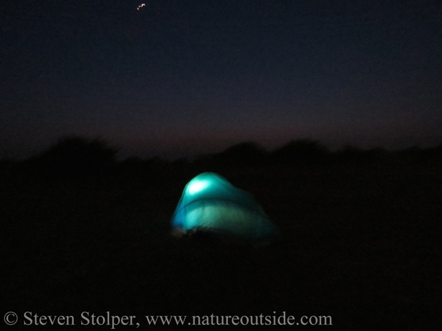Two person tent illuminated by Orbit Lantern