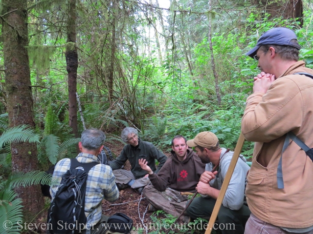 We huddle to plan our next move.  The berm is to the left and runs into the distance.