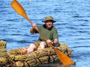 Paddling a tule boat I helped build.