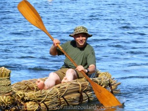 Paddling a tule boat I helped build.