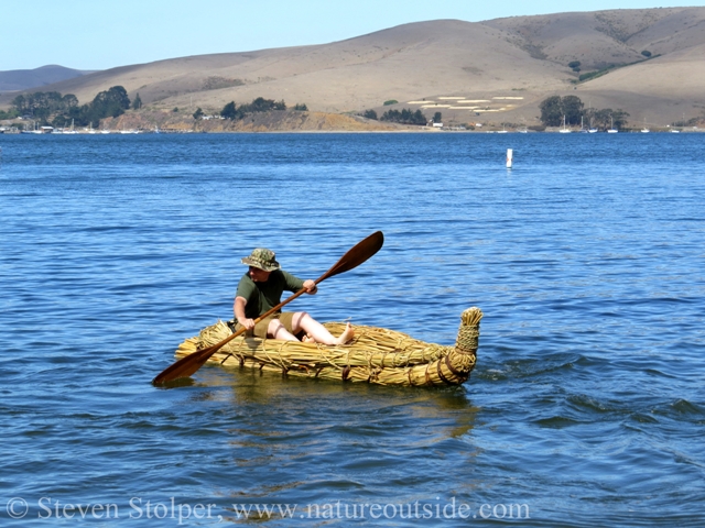 To turn the boat while paddling forward, I "sweep" the paddle wider on one side of the boat.