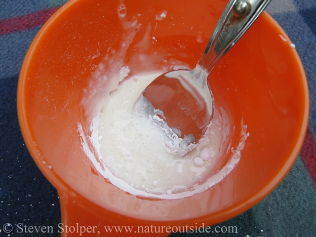Add just enough milk to the powdered sugar to make a moist mixture.