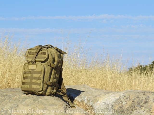backpack on rocks in hot sun