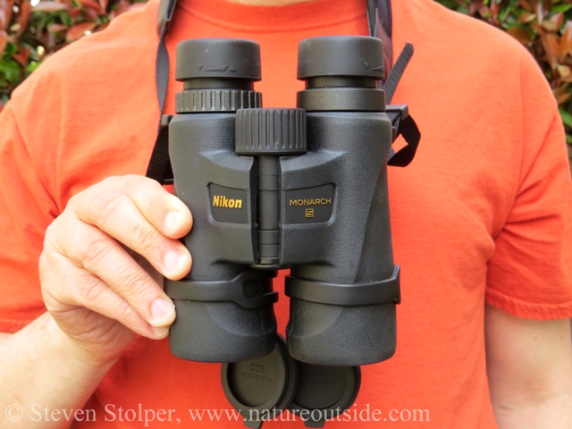 Person wearing Monarch 5 8x42 binoculars