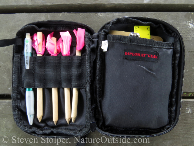 BDU pocket organizer filled with animal tracking tools