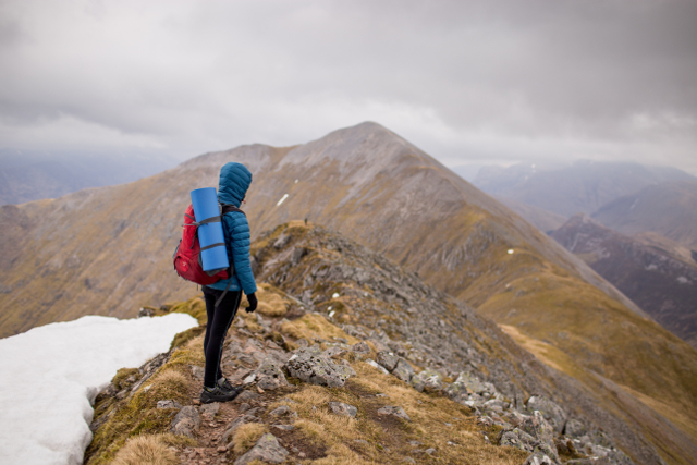 woman hiker on mountain ridge