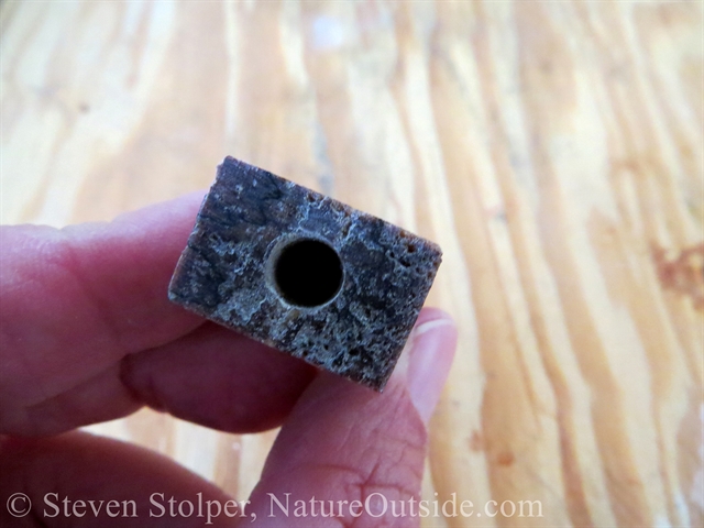 Hole in bottom of block for firesteel rod