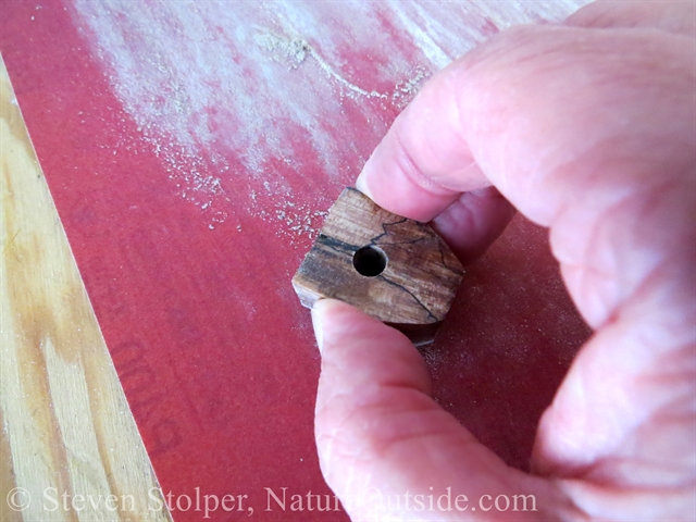 Sanding the handle of firesteel