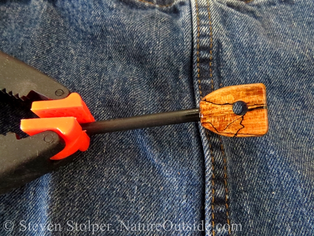 firesteel clamped over denim