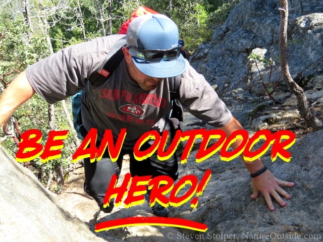 hiker climbing rock face