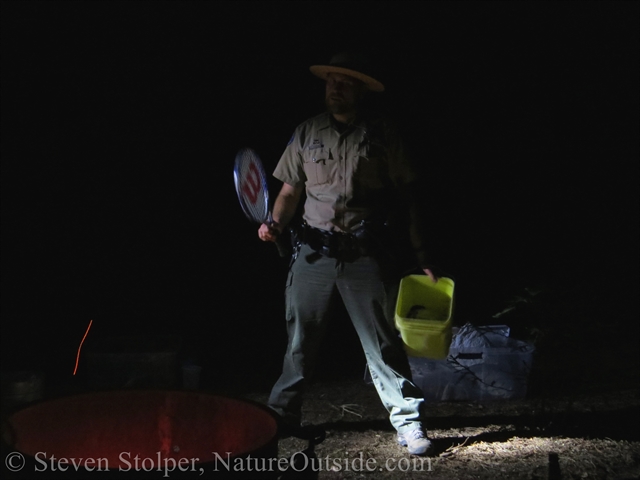 Ranger demonstrates harvesting grass seed 