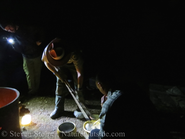 Ranger transfers the clean rock to the cooking basket