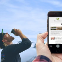 beer drinking hiker and cell phone