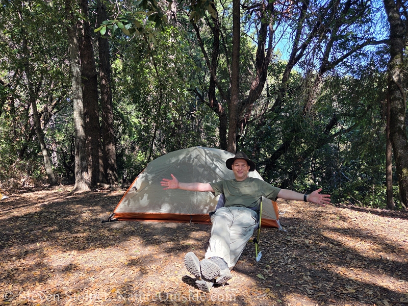 hiker sitting in Helinox Chair Zero