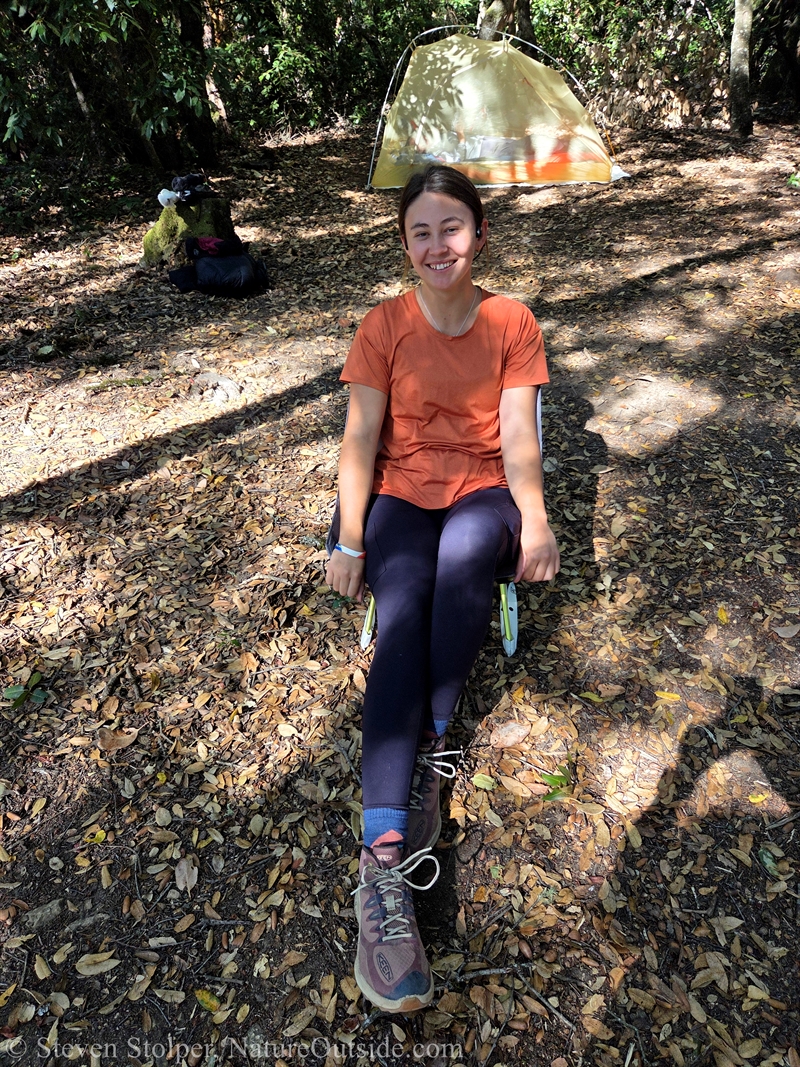 woman sitting in Helinox Chair Zero