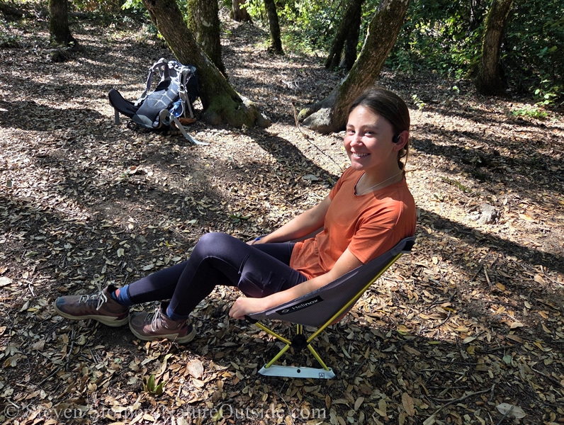 woman sitting in Helinox Chair Zero