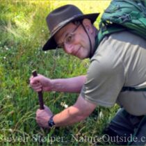 man using digging stick